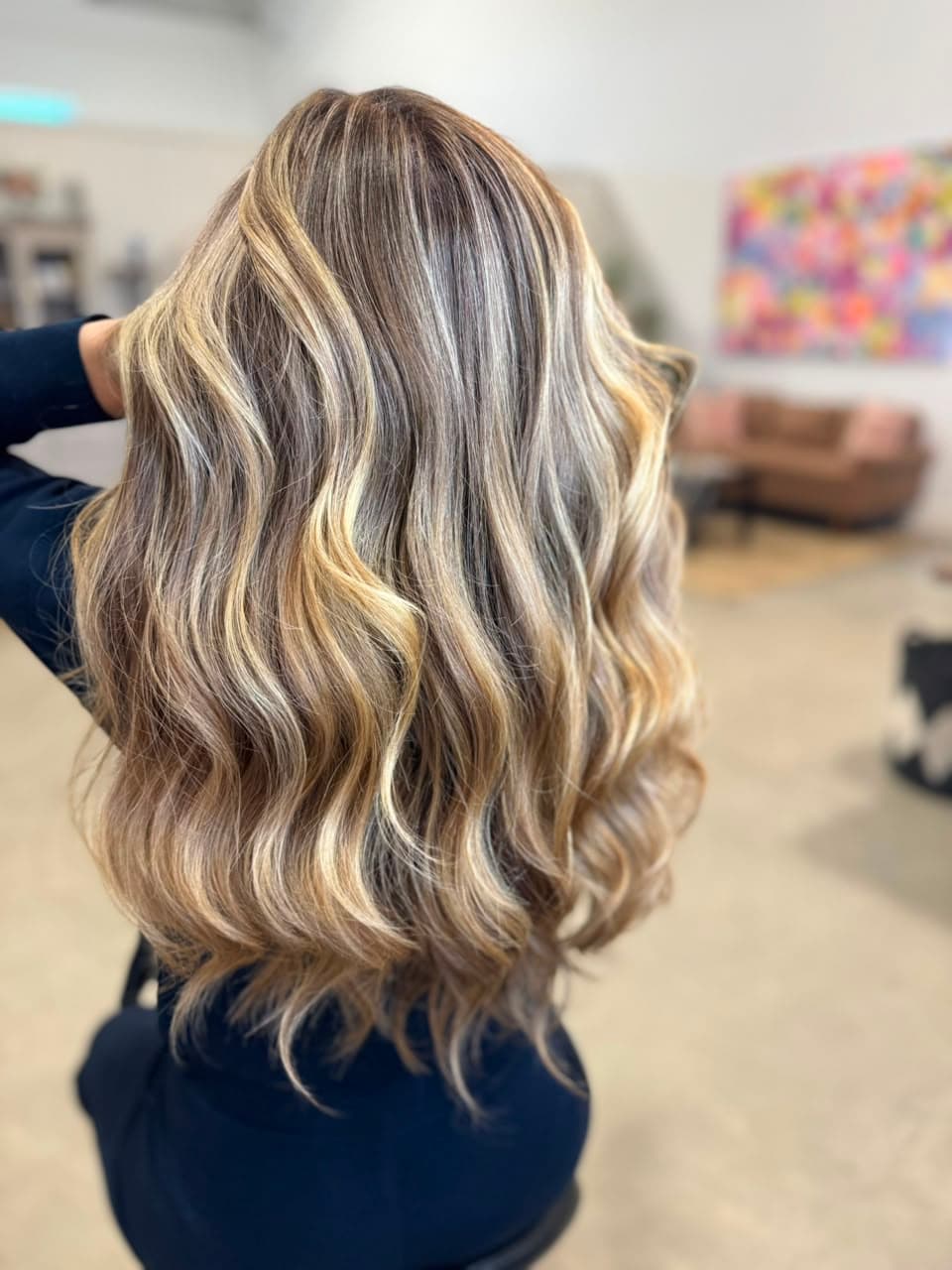 Back view of long waves with golden and beige blonde ribbons
